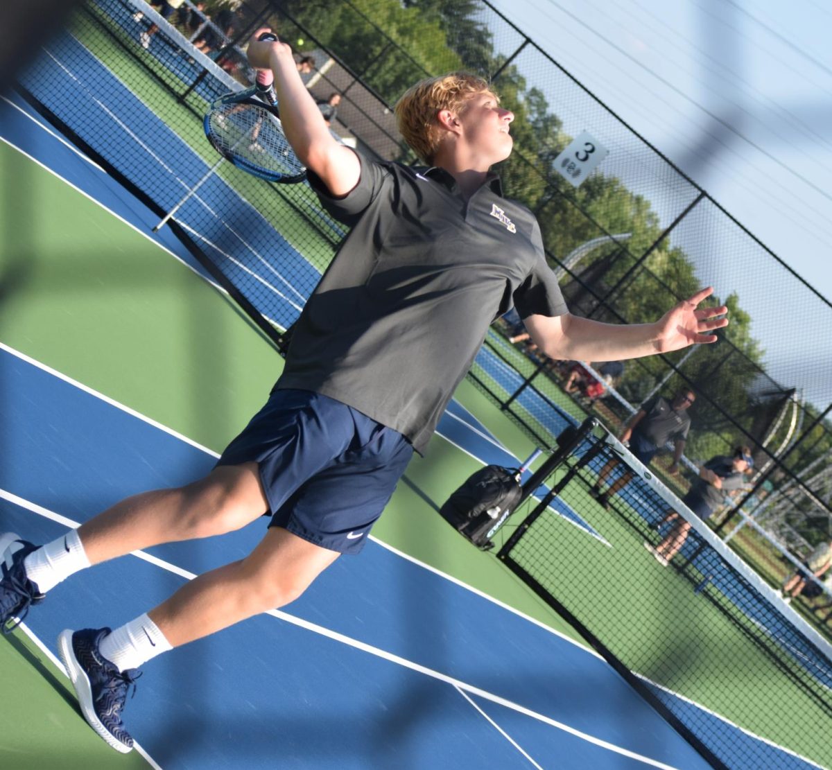 Sophomore Brady Nalley makes a practice serve.