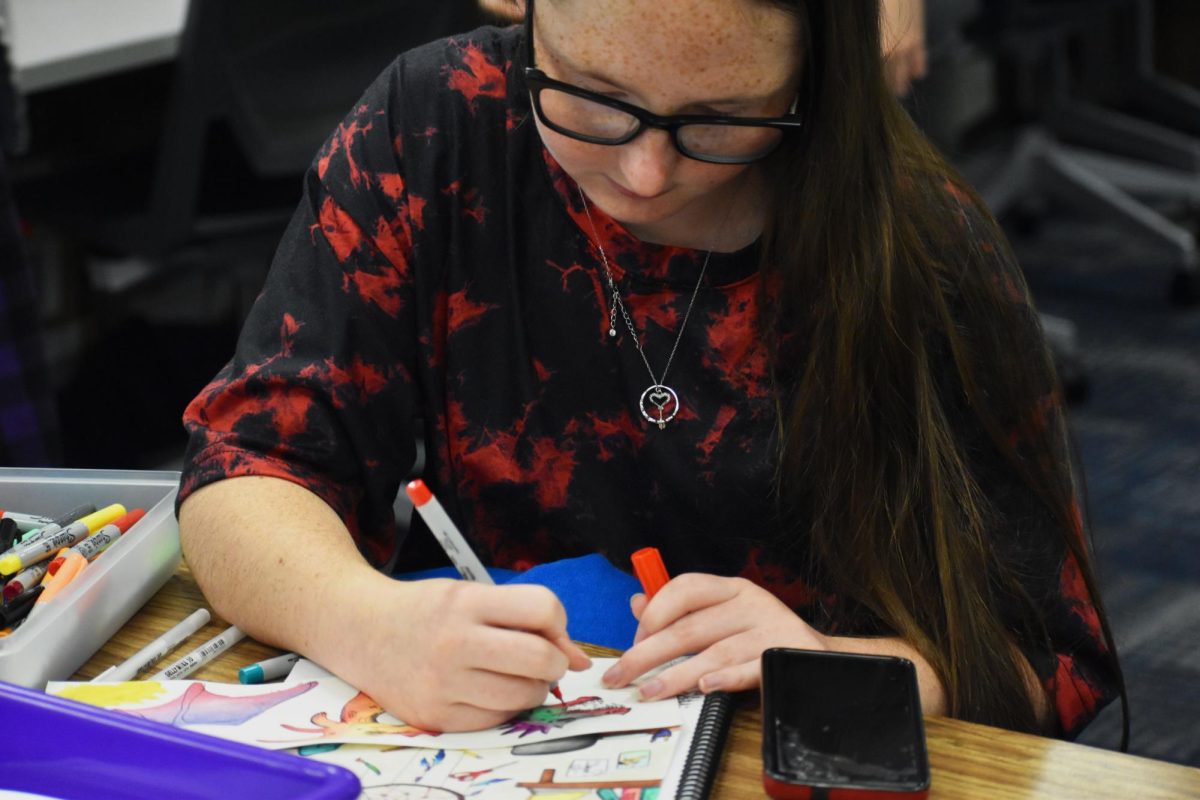 Senior Kai Crossland is in AP Art practicing her art skills. She was exploring with watercolor and trying to make patterns in the photo. “I was essentially practicing watercolor and making dragons out of blotches.” Crossland said. 
