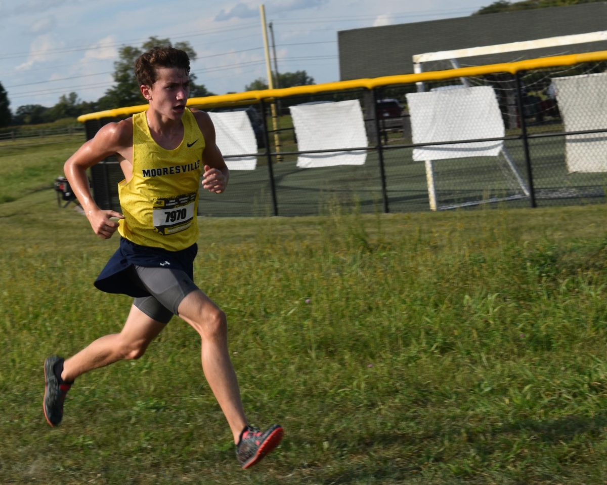 Sophomore Luke Merkle amps up his speed as he approaches the finish line. He started out behind everyone else. “Usually, I start more conservative then I push towards the end,” Merkle said.