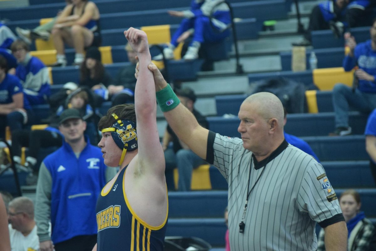 This photo displays Tommy Spikler winning his match.