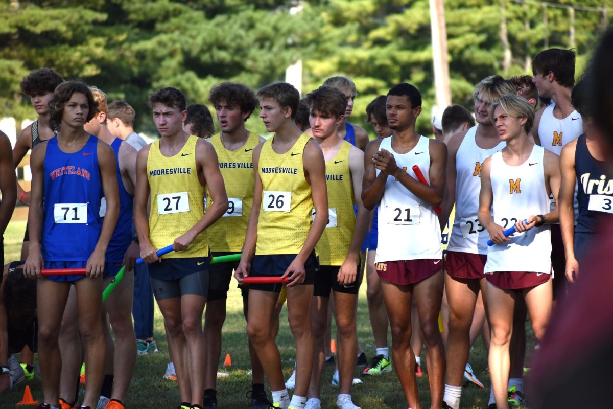 Junior Luke Merkle concentrates, preparing to start the relay. Merkle was about to run for Mooresville. Mooresville was up against Whiteland and various other surrounding schools. 