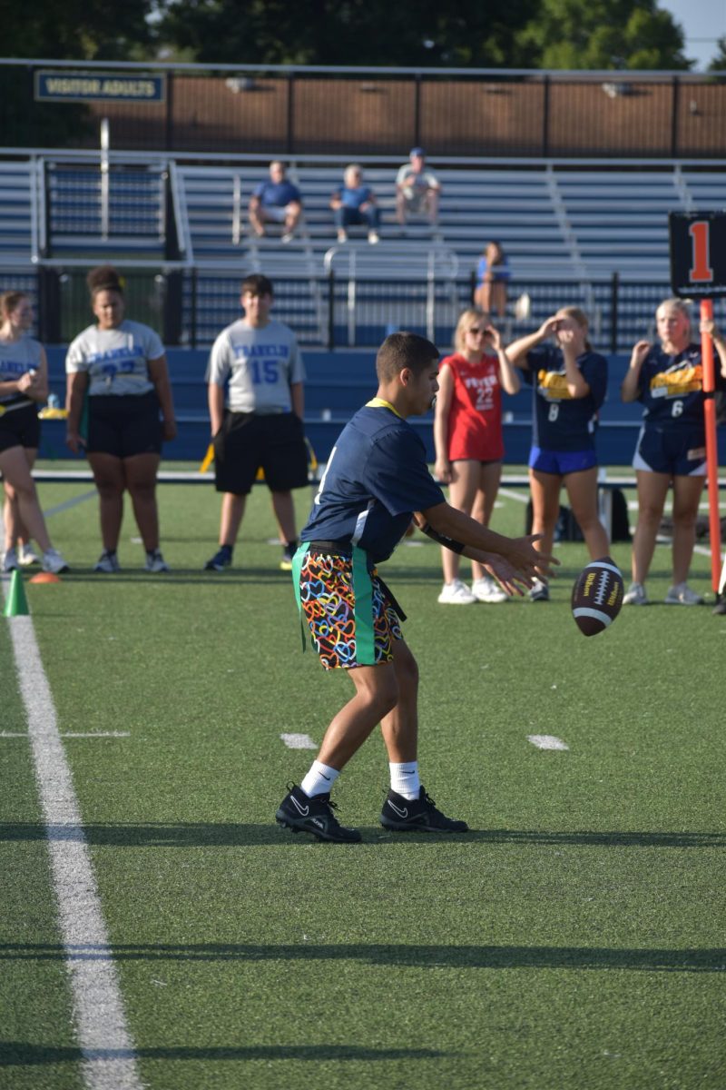 Sophomore Abraham Lopez ìs QB1 for the game against Franklin Community High School. Shortly after the photo was taken, Lopez threw around a 20 to 25 yard pass for a touchdown. "I was receiving the ball to make a pass in the endzone for a touchdown," Lopez said.
