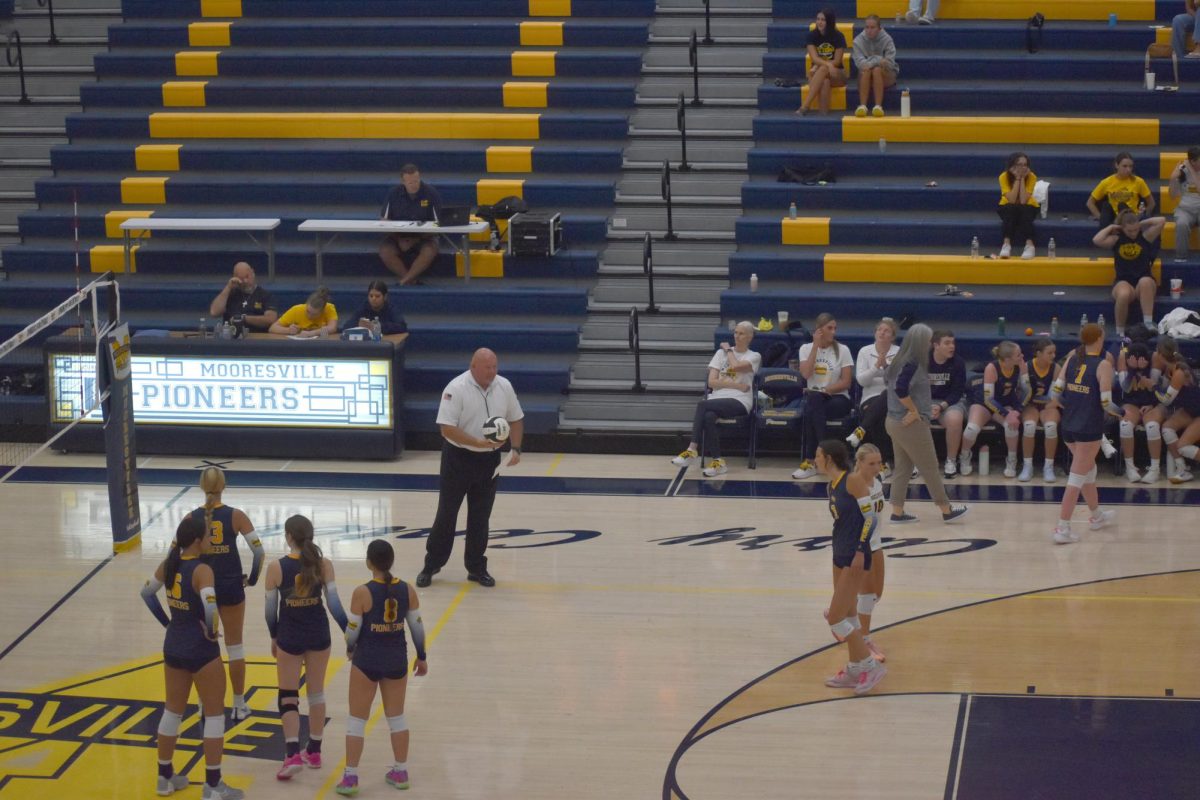 The Mooresville Varsity Volleyball team gets ready for its last face off against Herron High School. At this point, the Pioneers were tied with Herron in matches. “I am the number one defender, I was nervous for our first real match,” senior Izzy Vanover said.