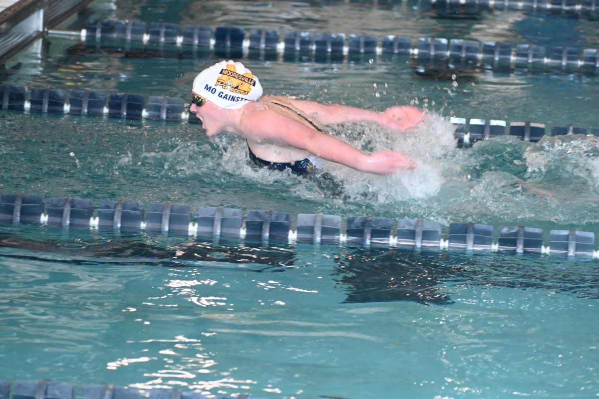 Sophmore Morgan Gainey swims in the  200 Individual Medley at the Mooresville Invitational. "I was nervous but as soon as I dove in the water and everything went away. I swam pretty well and I placed in the top 8. My favorite thing to swim is the 500. You may have a rough year but keep swimming and you will continue to get better," Gainey said.