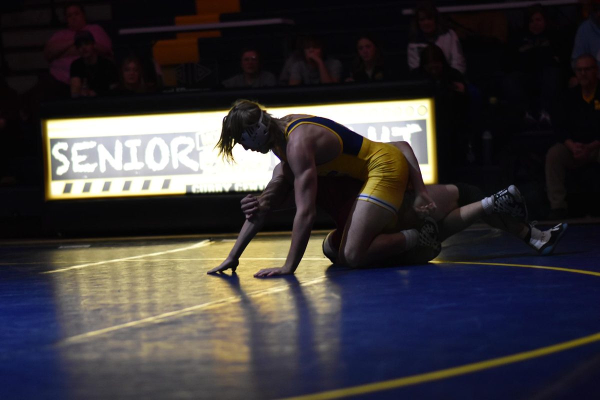 Senior Steelee Lynn gains an advantage on his opponent moments before pinning him. Lynn has wrestled throughout his entire time in high school.