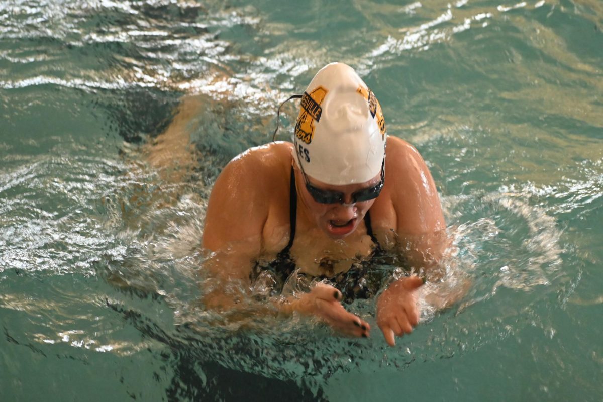Senior Arabella Brown swims at the Mooresville Invitational. Brown brought energy to the team in and out of the pool.  "Every year we host the Mooresville Invite with eight or nine schools. It's a huge meet and all about having fun. It is basically structured like a warm up to midstate,"  Brown said. 