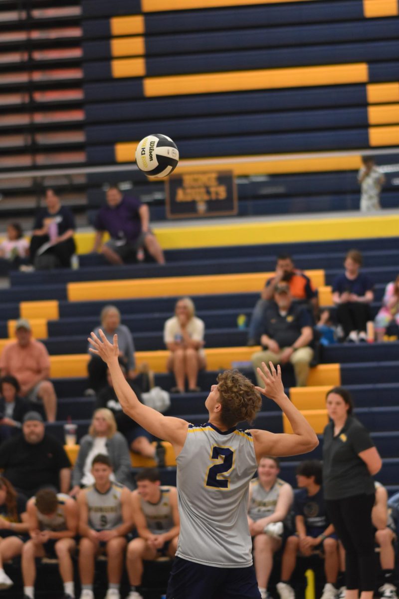 Junior Bryce Bodell serves the ball to the other side of the court. This was Bodell's first year on the team. "Serving is a crucial part of volleyball, so I was trying to get the ball in bounds without giving the other team an easy pass," Bodell said.