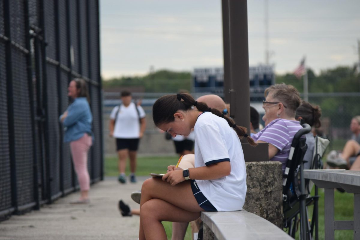 Junior Jacey Bell calculates stats for the match. It was a way to score how the guys played during their game. “I will calculate the numbers then give them percentages the next day. It helps them see how they performed number wise,” Bell said.