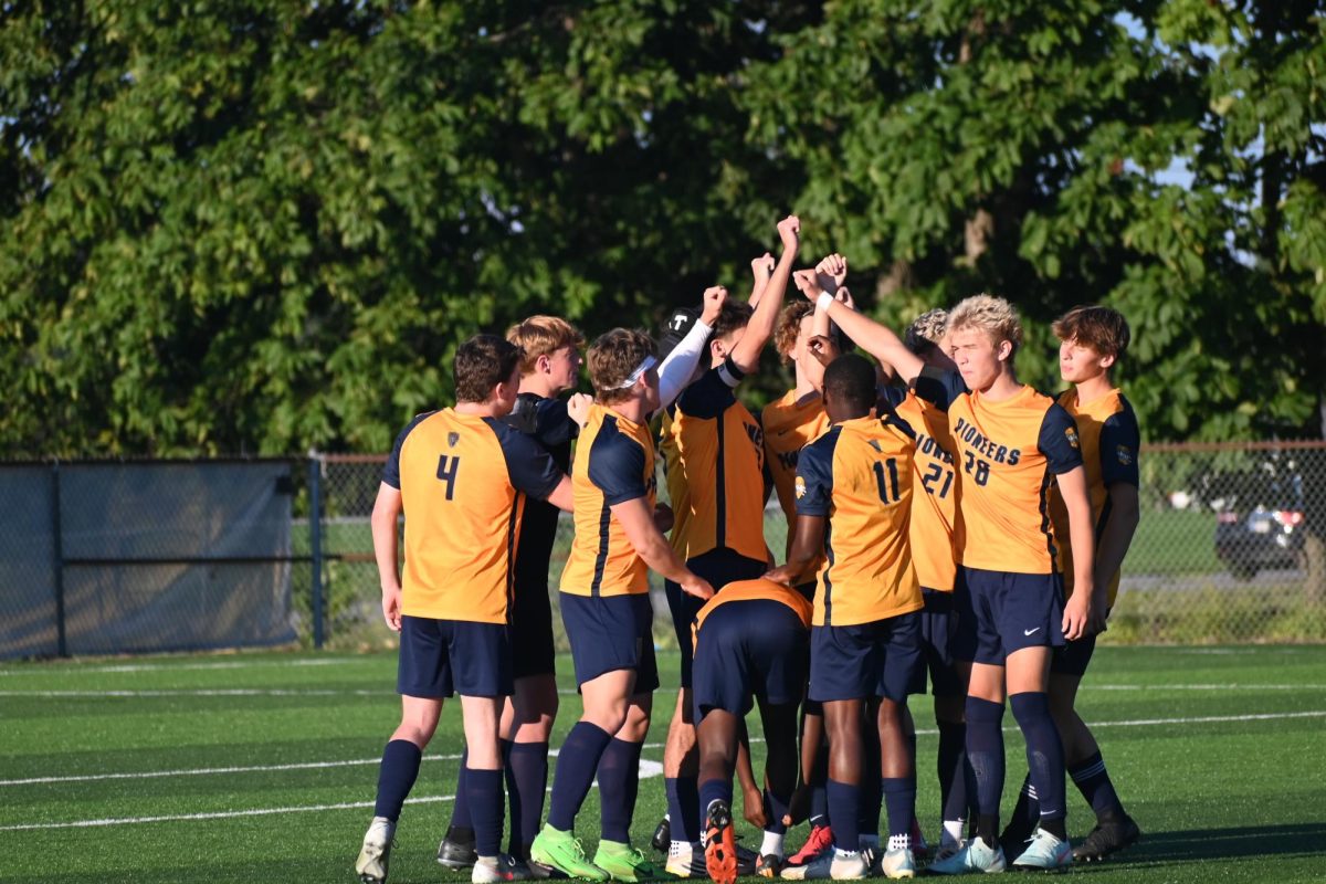 The team breaks out of their huddle right before the game starts. The team shares a moment of prayer before each match before they break out.