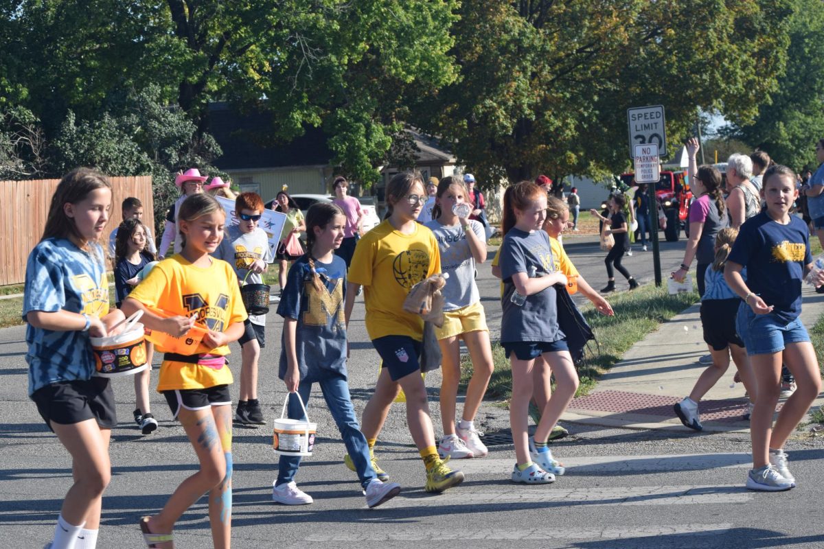 Elementary students march in the 2023 Parade.