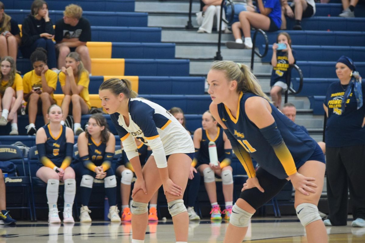 Senior Ashlyn Nielsen prepares to pass off serve receive. Nielsen played defensive specialist and middle blocker in the game against Decatur on August 13. “My plan is to go to college for volleyball,” Nielsen said.  