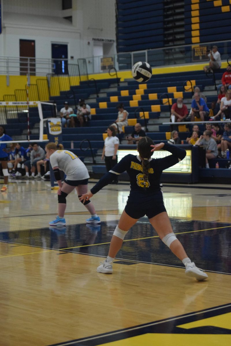 Freshman Skylah Boyden serves the ball in their game against Franklin Central.