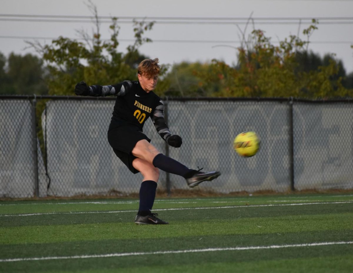 Freshman Nolan Speaks sends the ball to the other side of the field with a goal-kick.
