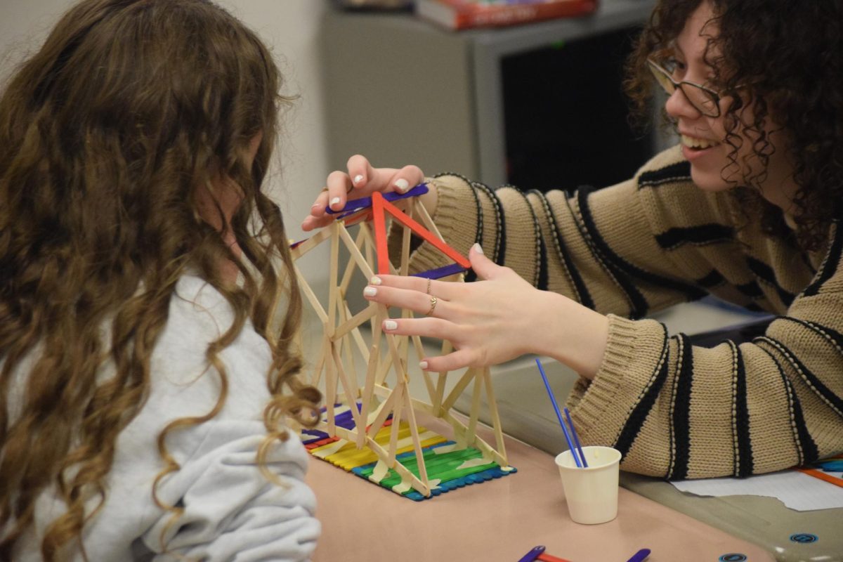 Geometry students work together to build model bridges in geometry teacher Kyla Carlsberg's class.