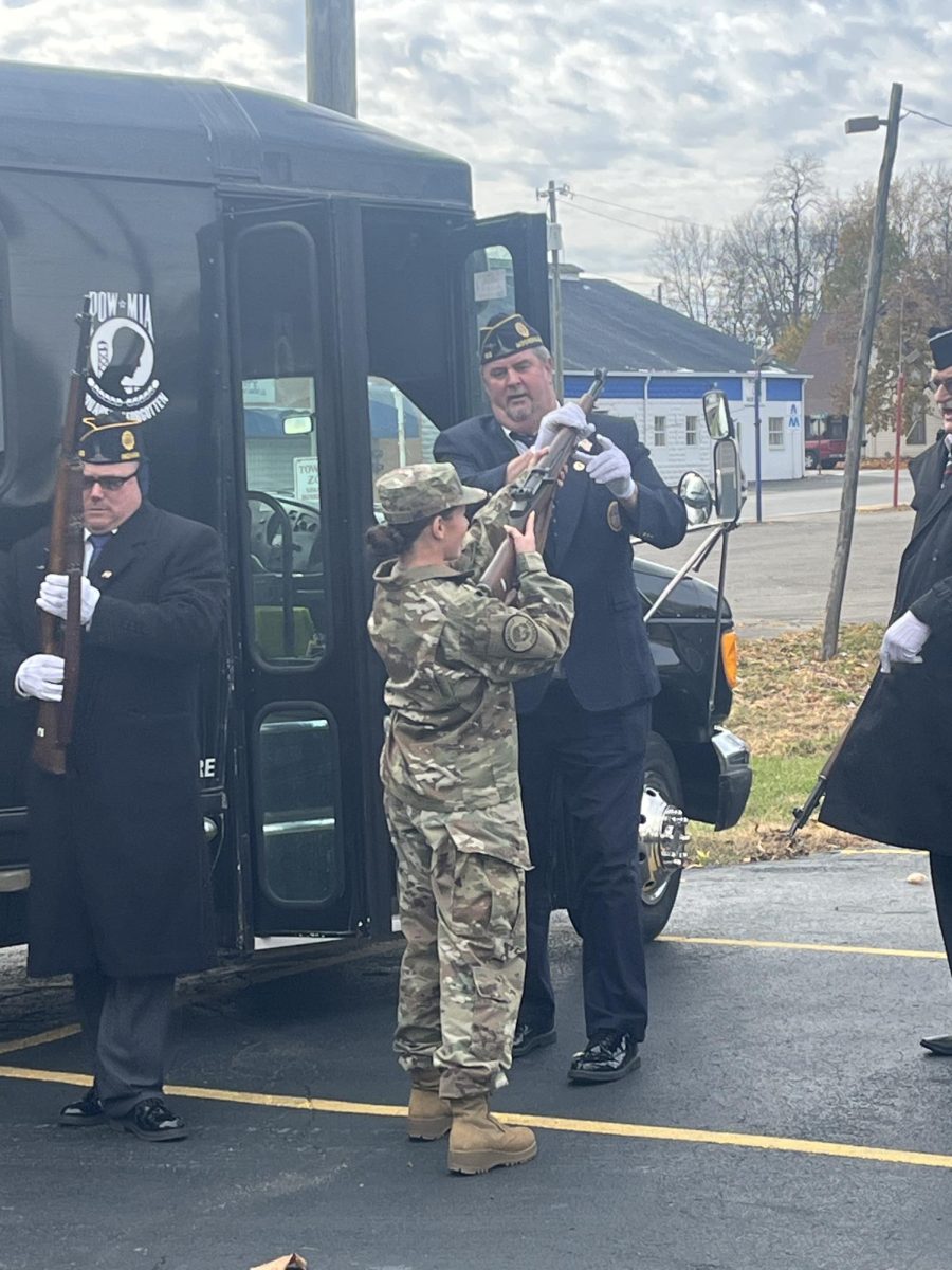 Junior Julianna Bell practicing before participating in the honor guard.