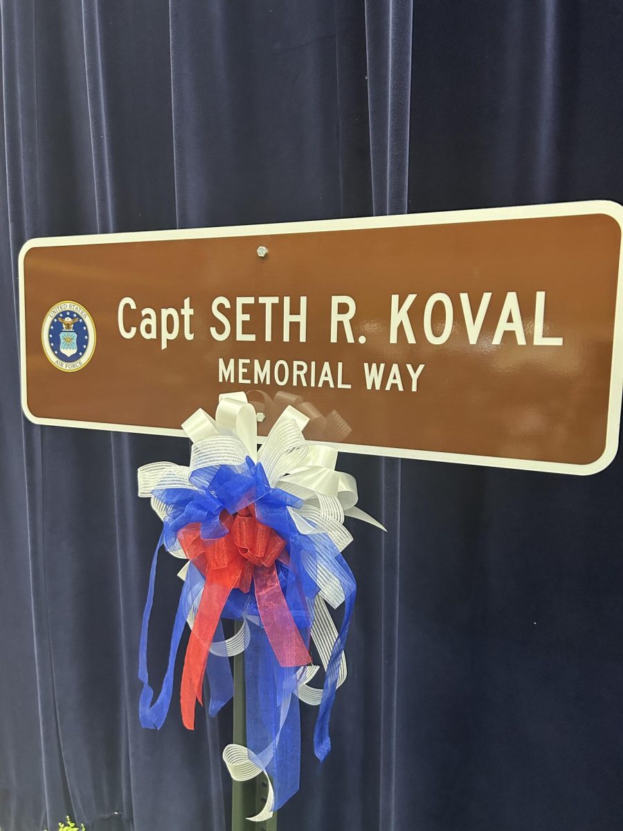 Memorial street sign revealed on stage at Captain Seth R. Koval's memorial service. Captain Koval was a Mooresville resident who passed during his service overseas.